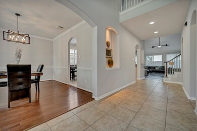 Inviting entry flanked by large dining room and pr