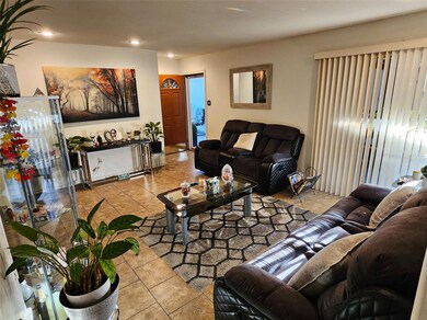 Living area featuring recessed lighting and tile p