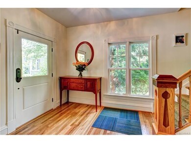 Warm and welcoming foyer is highlighted by the cus