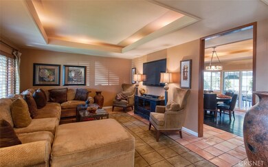 Family room off of entry opens to game room