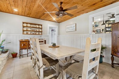 Dining area with wooden ceiling, wainscoting, a c