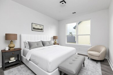 Bedroom featuring baseboards and light wood finis