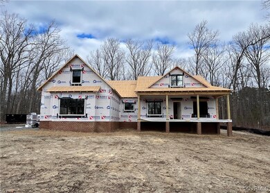 Property in mid-construction with covered porch