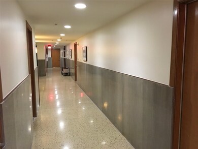 Hall with wainscoting and recessed lighting