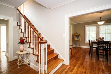 Elegant stairs lead to the second floor and around