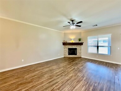 Unfurnished living room featuring hardwood / wood-