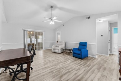 Interior space featuring ceiling fan, light hardwo