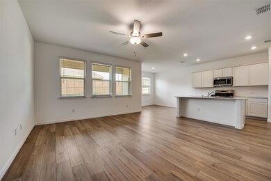 Kitchen featuring stainless steel appliances, ligh