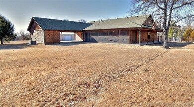 Private screen porch at rear of home.  Carport off