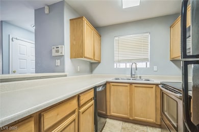 Kitchen featuring black dishwasher, stainless stee