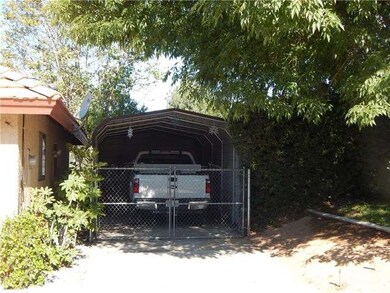 CARPORT ON SIDE OF HOME STAYS, EXCELLENT FOR THAT 