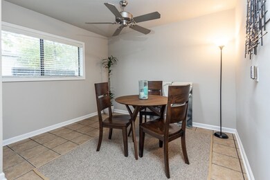 Dining area featuring ceiling fan and tile pattern