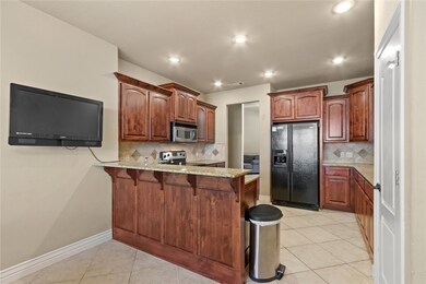 Eat-in kitchen area and eat at bar area.