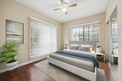 Bedroom with wood finished floors and a ceiling f