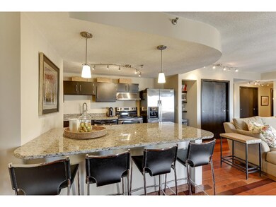 The granite penisula in the kitchen seats four.