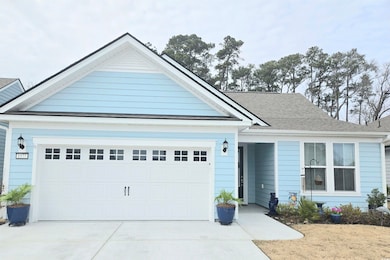Ranch-style home featuring driveway, a shingled ro