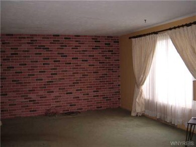 Living Room. Picture window, newer carpet over nev