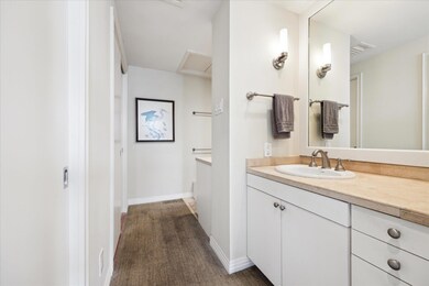 Bathroom with vanity and baseboards