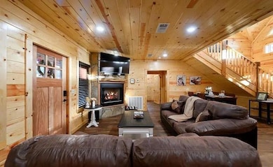 Living room with wooden ceiling, hardwood / wood-s
