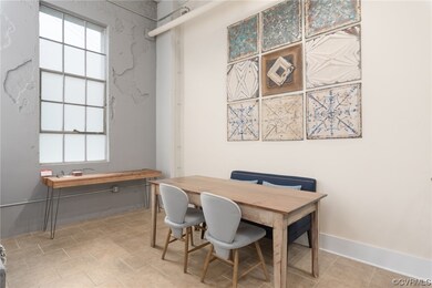 Tiled dining area featuring a wealth of natural light