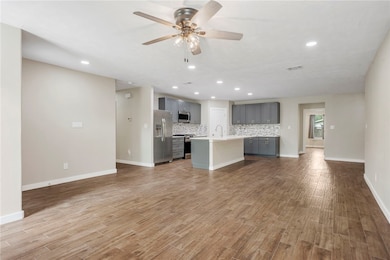 Open concept living, dining and kitchen that has b
