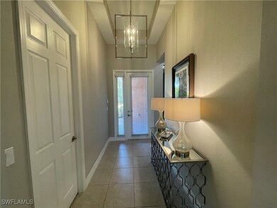 Entrance foyer featuring tile patterned floors and