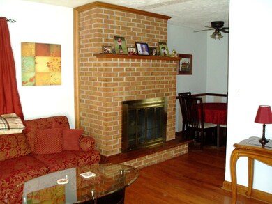 Fireplace adjoins the eat-in-kitchen