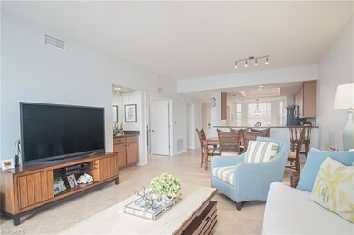 Living room featuring light tile floors and rail l