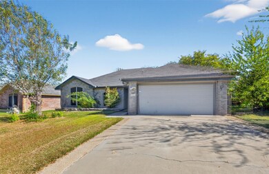 View of front of home with brick siding, a front 