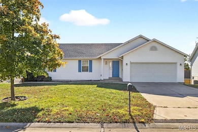 Single story home featuring driveway, a front yard, a garage, and roof with shingles