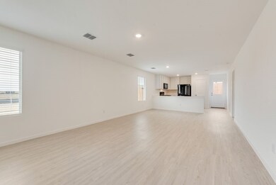 Unfurnished living room with recessed lighting, light wood-type flooring, visible vents, and baseboards