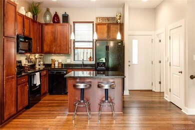 Cherry cabinets, granite counters, and tile backsp