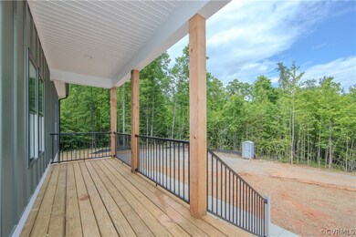 The front porch is covered and has outdoor lightin