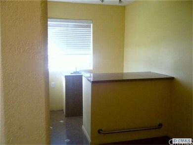 Small wet bar area off entry