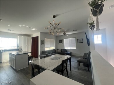 Dining space featuring a chandelier, dark wood-sty
