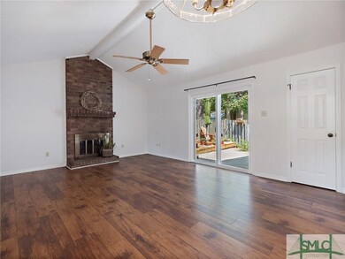 Huge living and dining area has a gas fireplace wi