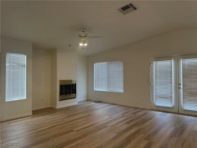 Unfurnished living room featuring heating unit, a