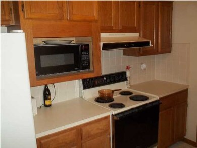 More of the Oak cabinets and the range. There is a