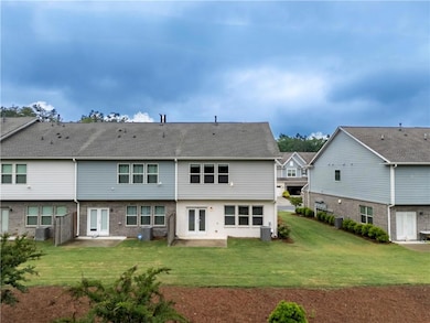 Back of house featuring french doors, a patio, a l