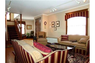 Living Room. View towards staircase and vestibule.