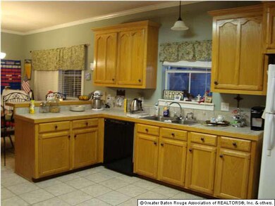 The spacious Kitchen has tiled floors and counter 