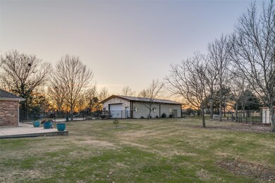 Back yard at dusk with view of shop