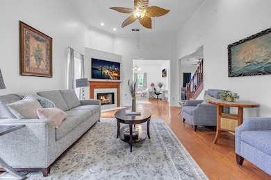 Living room with ornamental molding, ceiling fan, 