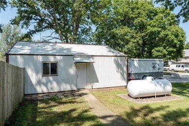 SIDE ENTRY TO THIS OVER SIZED 2 CAR GARAGE LEADS T