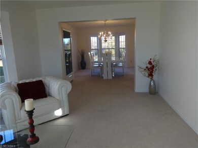 Living room open to dining room.