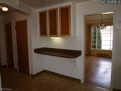 View from kitchen sink to dining room and back hal