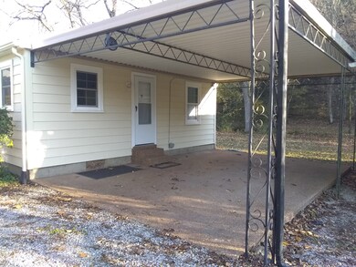 GREAT CARPORT CAN BE USED AS A COVERED PORCH