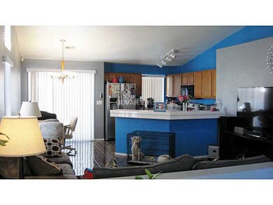 Kitchen. Open floor plan with vaulted ceiling.