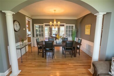 View from the living room into the formal dining room.  Just beyond is the sunroom that is used as a gameroom.