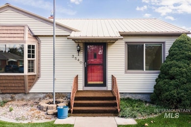Entrance to property with a metal roof
